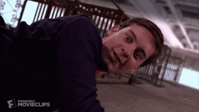 A Close Up Of A Man Laying On The Floor With A Fandango Movieclips Logo Behind Him GIF