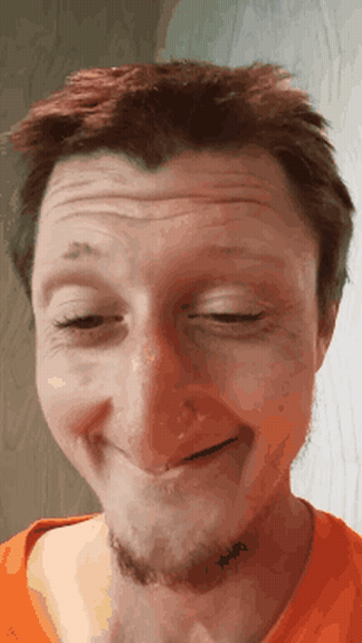 A Close Up Of A Man Making A Face With His Eyes Closed GIF