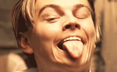 A Close Up Of A Man Making A Face With His Tongue Out GIF