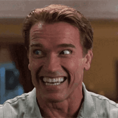 A Close Up Of A Man Making A Funny Face While Smiling . GIF