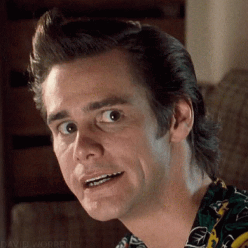 A Close Up Of A Man Making A Funny Face While Wearing A Colorful Shirt . GIF