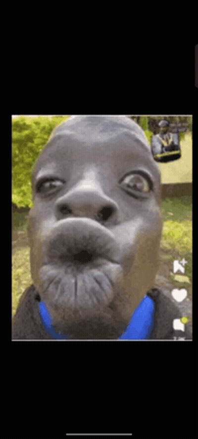 A Close Up Of A Man Making A Funny Face With A Blue Shirt . GIF