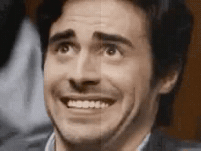 A Close Up Of A Man Making A Funny Face With His Mouth Open . GIF