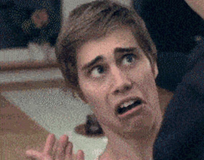 A Close Up Of A Man Making A Funny Face With His Mouth Open GIF