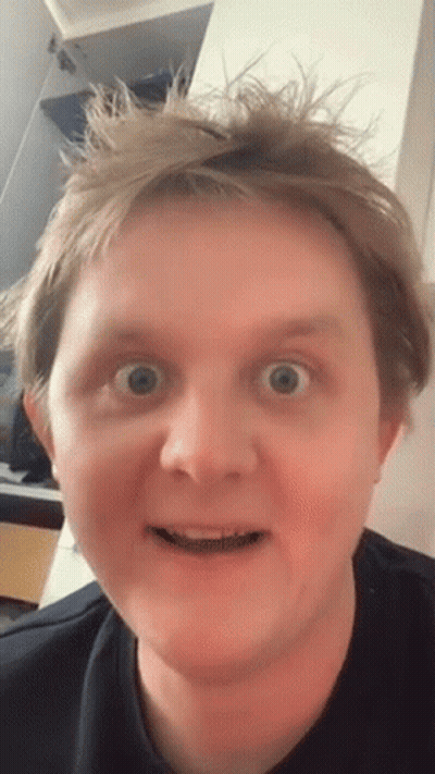 A Close Up Of A Man Making A Funny Face With His Mouth Open GIF