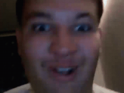 A Close Up Of A Man Making A Funny Face With His Tongue Hanging Out . GIF