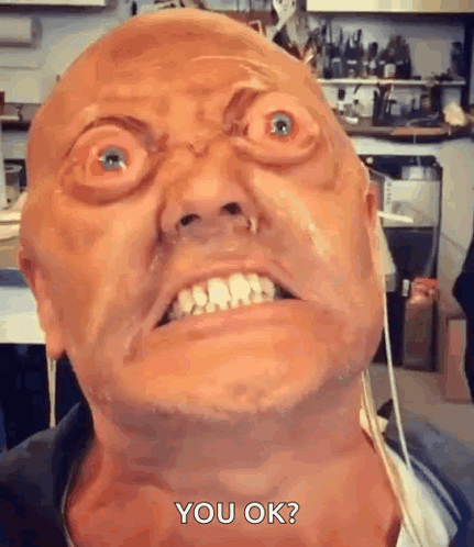 A Close Up Of A Man Making A Funny Face With The Words `` You Ok '' Written On The Bottom . GIF