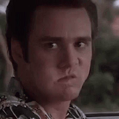 A Close Up Of A Man Making A Surprised Face While Sitting In A Car . GIF