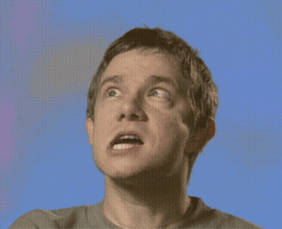 A Close Up Of A Man 'S Face Against A Blue Background GIF