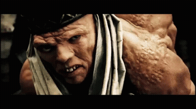 A Close Up Of A Man 'S Face And Arm GIF