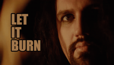 A Close Up Of A Man 'S Face And The Words Let It Burn GIF