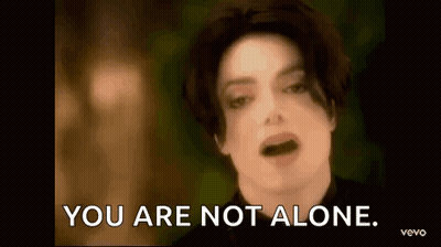 A Close Up Of A Man 'S Face And The Words `` You Are Not Alone '' . GIF