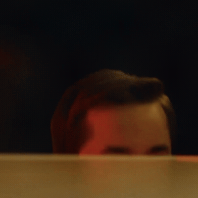 A Close Up Of A Man 'S Face Behind A Screen GIF