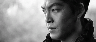 A Close Up Of A Man 'S Face In A Black And White Photo With A Serious Look On His Face . GIF