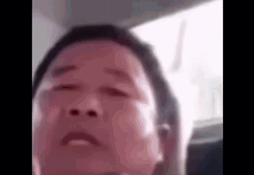 A Close Up Of A Man 'S Face In A Car With His Eyes Closed GIF