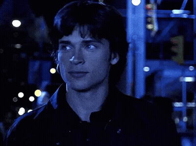A Close Up Of A Man 'S Face In A Dark Room GIF