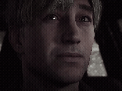 A Close Up Of A Man 'S Face In A Dark Room . GIF