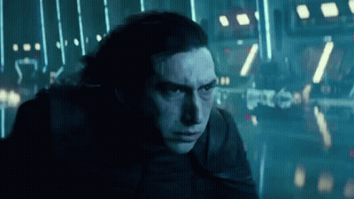 A Close Up Of A Man 'S Face In A Dark Room With Lights . GIF