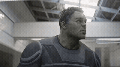 A Close Up Of A Man 'S Face In A Gray Suit GIF