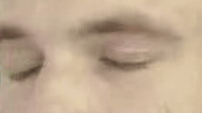 A Close Up Of A Man 'S Face In A Green Circle GIF