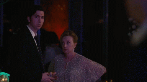 A Close Up Of A Man 'S Face In A Suit And Tie GIF