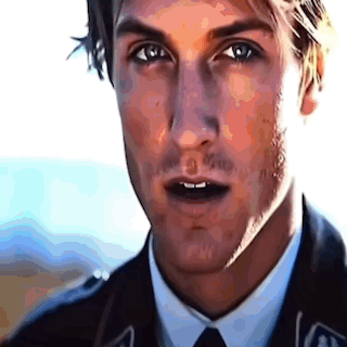 A Close Up Of A Man 'S Face In A Suit And Tie GIF
