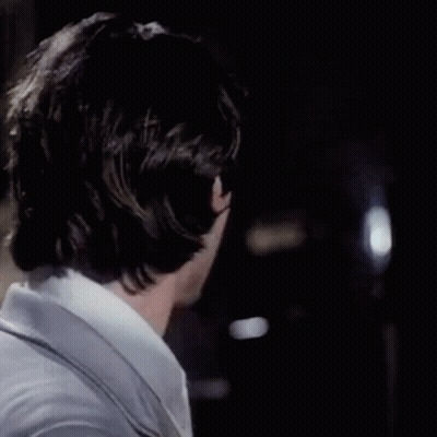 A Close Up Of A Man 'S Face In A Suit And Tie With His Eyes Closed . GIF