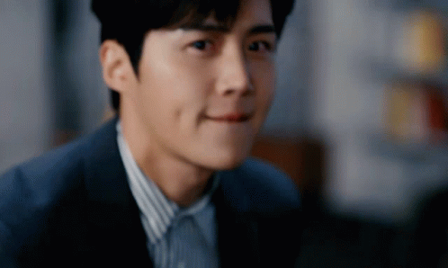 A Close Up Of A Man 'S Face In A Suit GIF