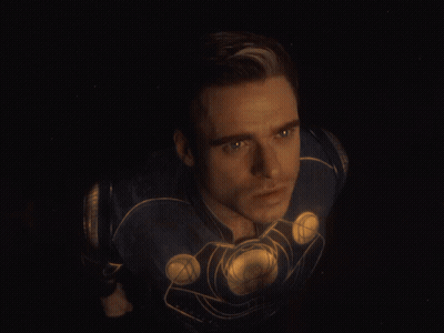 A Close Up Of A Man 'S Face In A Superhero Costume GIF