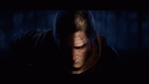 A Close Up Of A Man 'S Face In A Video Game With A Quote That Says Defend Him With Your Life . GIF