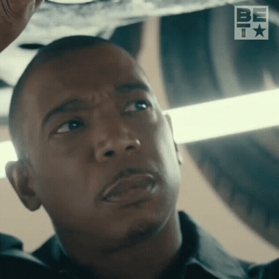 A Close Up Of A Man 'S Face In Front Of A Be T Logo GIF