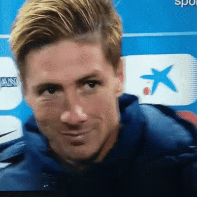 A Close Up Of A Man 'S Face In Front Of A Blue Background GIF