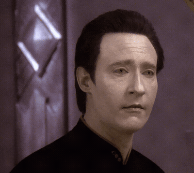 A Close Up Of A Man 'S Face In Front Of A Door GIF