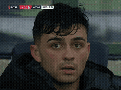 A Close Up Of A Man 'S Face In Front Of A Scoreboard That Says Fcb 4 3 Atm 85:28 GIF