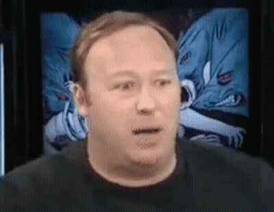 A Close Up Of A Man 'S Face In Front Of A Screen GIF