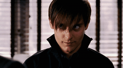 A Close Up Of A Man 'S Face In Front Of A Window With Blinds GIF