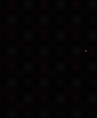 A Close Up Of A Man 'S Face In The Dark GIF