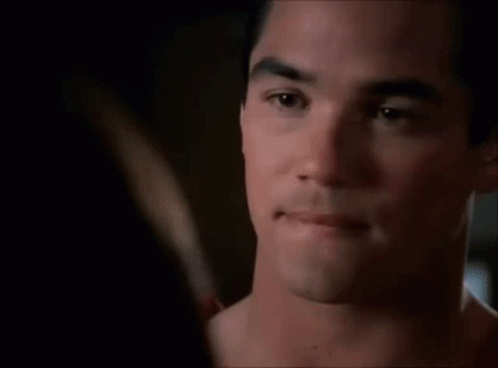 A Close Up Of A Man 'S Face Looking At A Woman 'S Face . GIF