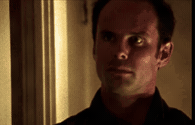A Close Up Of A Man 'S Face Looking At The Camera GIF