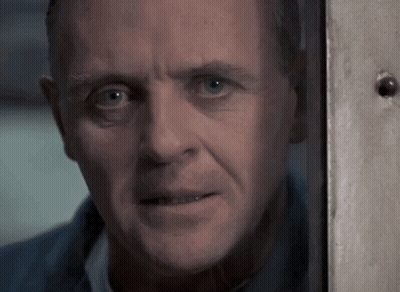 A Close Up Of A Man 'S Face Looking Out A Window GIF
