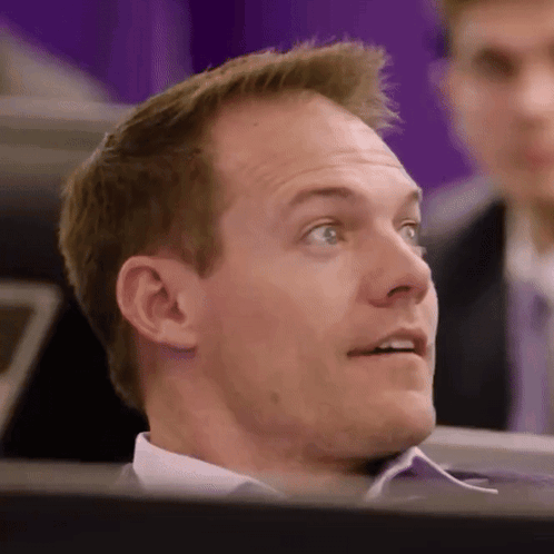 A Close Up Of A Man 'S Face Looking Up At Something GIF