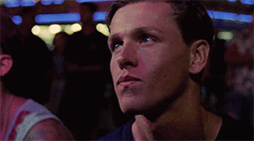 A Close Up Of A Man 'S Face Looking Up At Something GIF