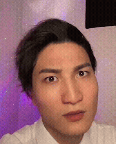 A Close Up Of A Man 'S Face Making A Funny Face GIF
