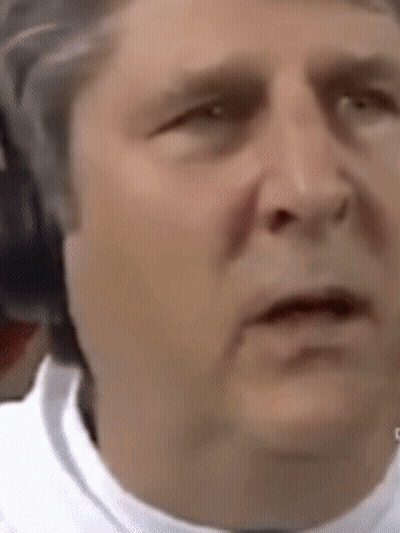A Close Up Of A Man 'S Face Making A Funny Face . GIF