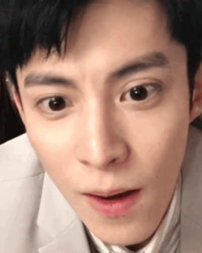 A Close Up Of A Man 'S Face Making A Funny Face GIF