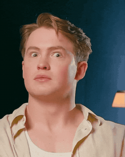 A Close Up Of A Man 'S Face Making A Funny Face GIF