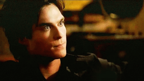 A Close Up Of A Man 'S Face Making A Funny Face . GIF
