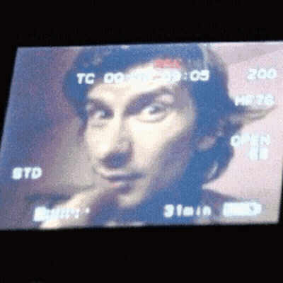 A Close Up Of A Man 'S Face On A Screen That Says Tc 09 GIF