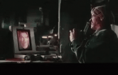 A Close Up Of A Man 'S Face On A TV Screen . GIF