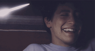 A Close Up Of A Man 'S Face Smiling GIF